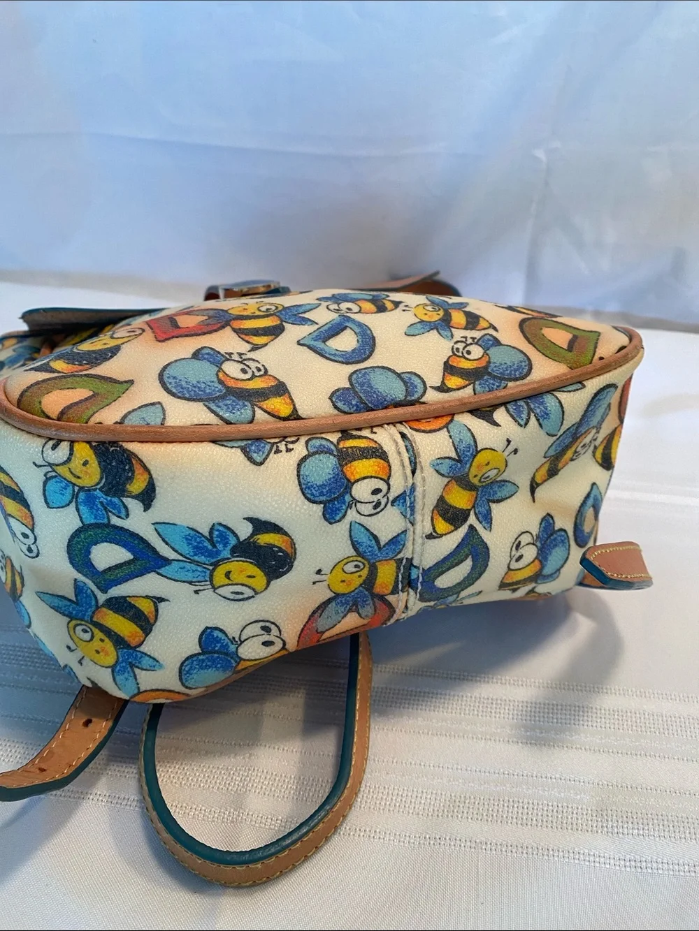 Dooney & Bourke Bee Print Satchel in Tan and Cream with Blue & Yellow Accents